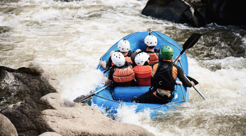 People playing raft adventure sport activity in the river